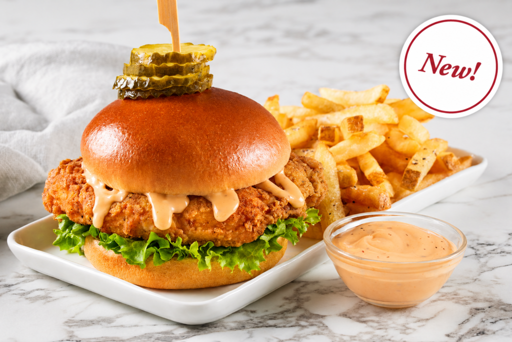 Burgers & Sandwiches, Crispy fried chicken sandwich with lettuce, creamy sauce and pickles, served with golden French fries and dipping sauce.