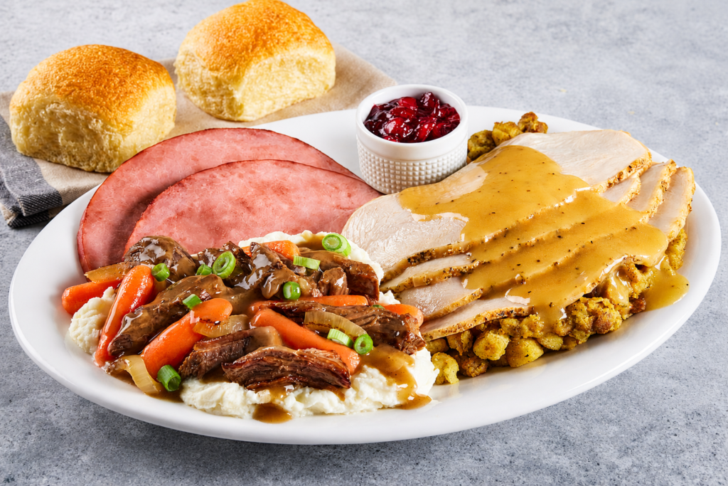 Dinner Combos, Turkey and ham dinner combo with stuffing, gravy, mashed potatoes, pot roast, carrots, cranberry sauce and fresh dinner rolls.