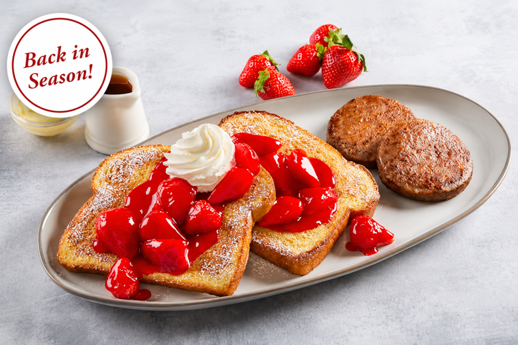 Fresh Strawberry French Toast Combo, Fresh strawberry French toast topped with glazed strawberries, whipped cream and powdered sugar, served with sausage patties for a seasonal breakfast combo.
